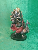 Ganesh spelar flöjt