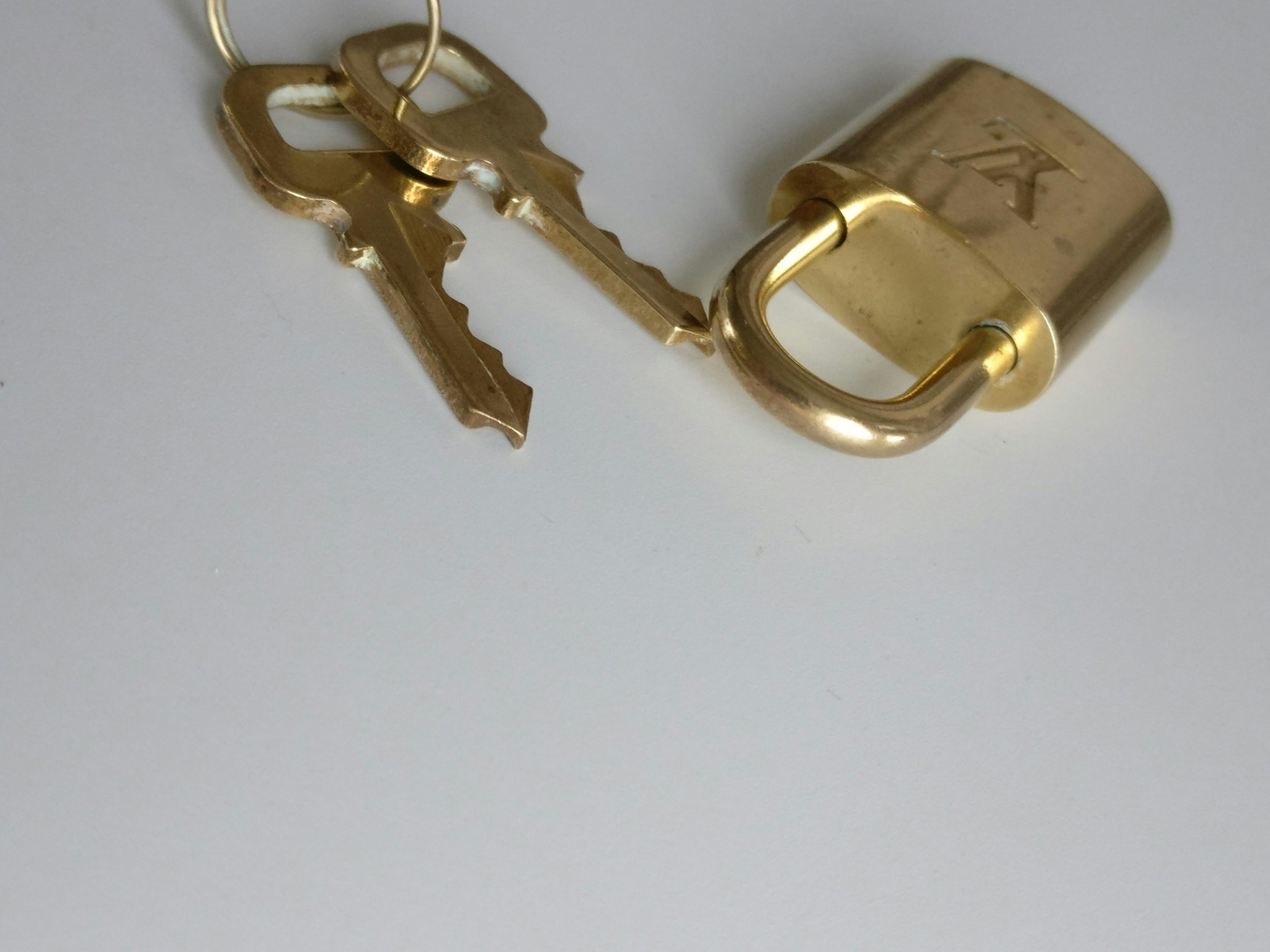 Rent Louis Vuitton Brass Gold Padlock 2 Keys with Bag in London