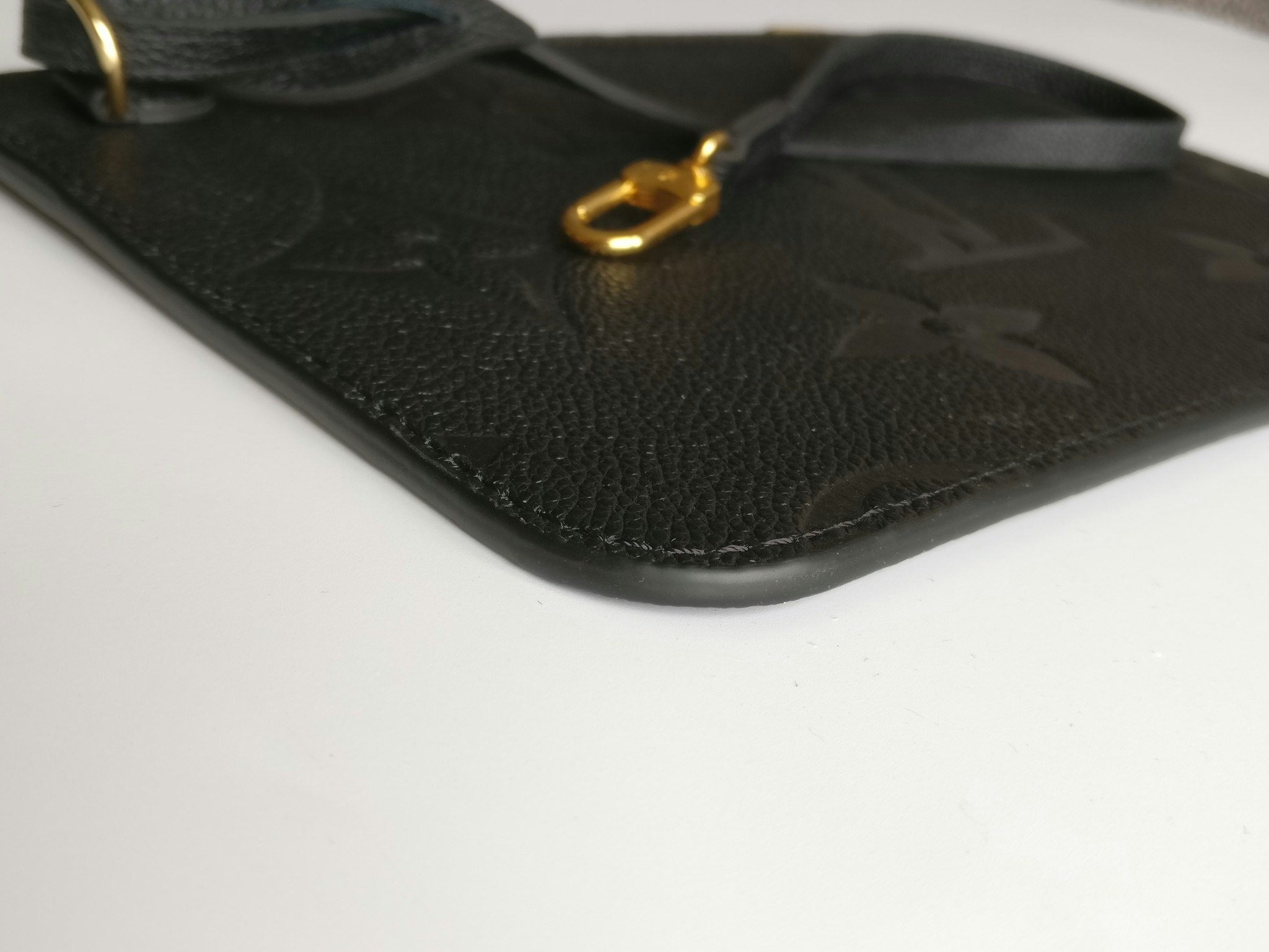 Louis Vuitton Neverfull empreinte clutch