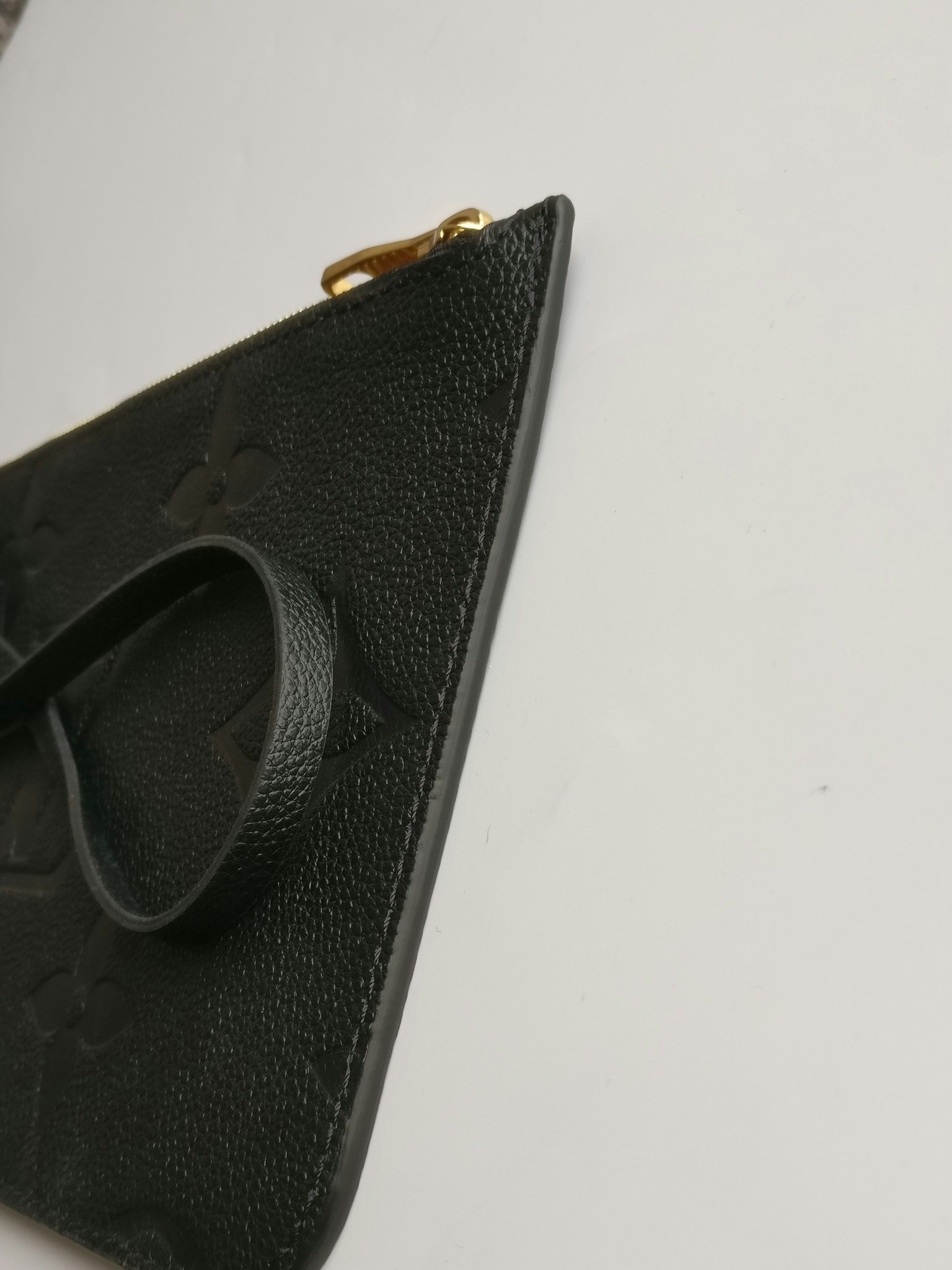 Louis Vuitton Neverfull empreinte clutch
