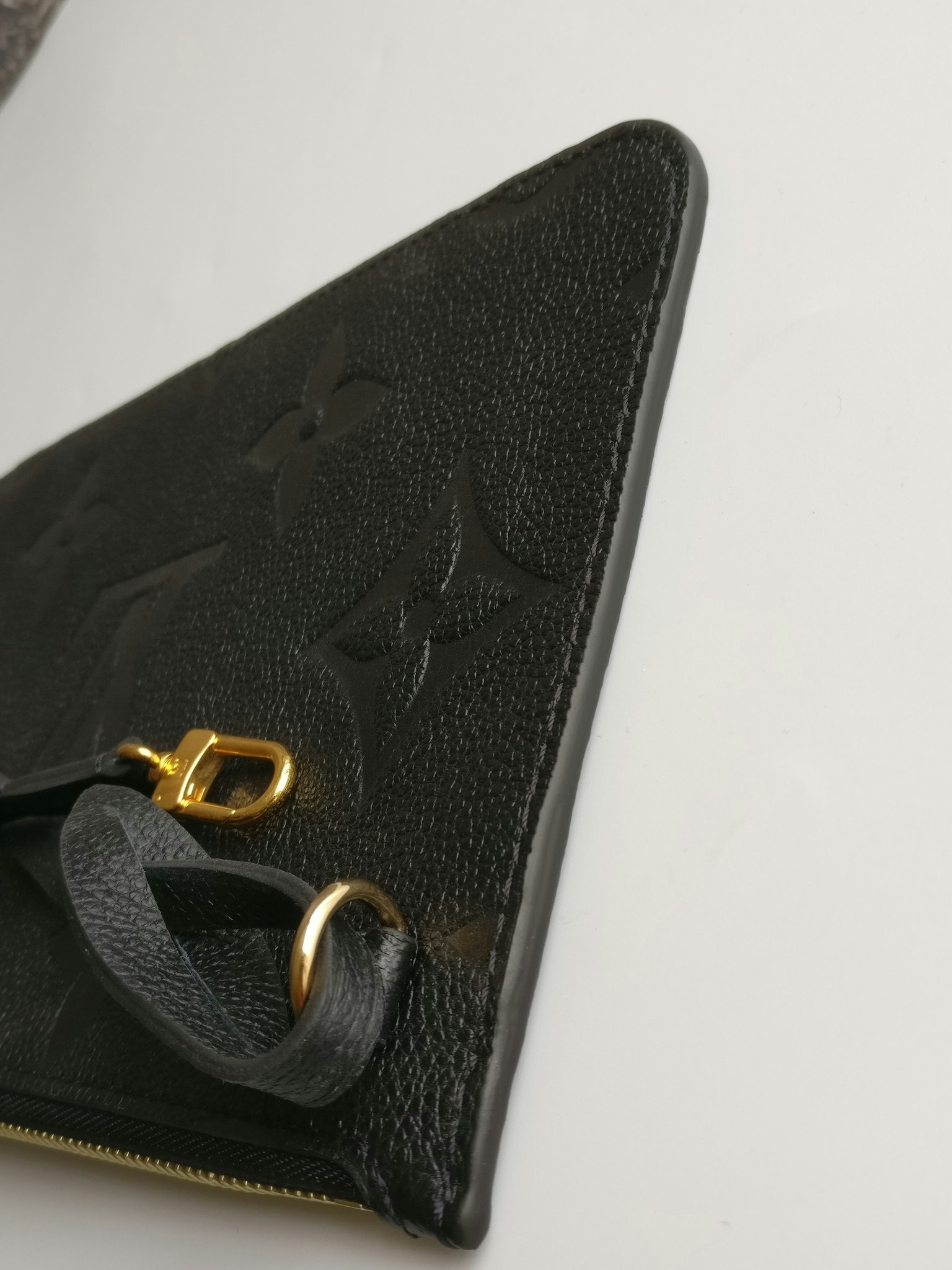 Louis Vuitton Neverfull empreinte clutch