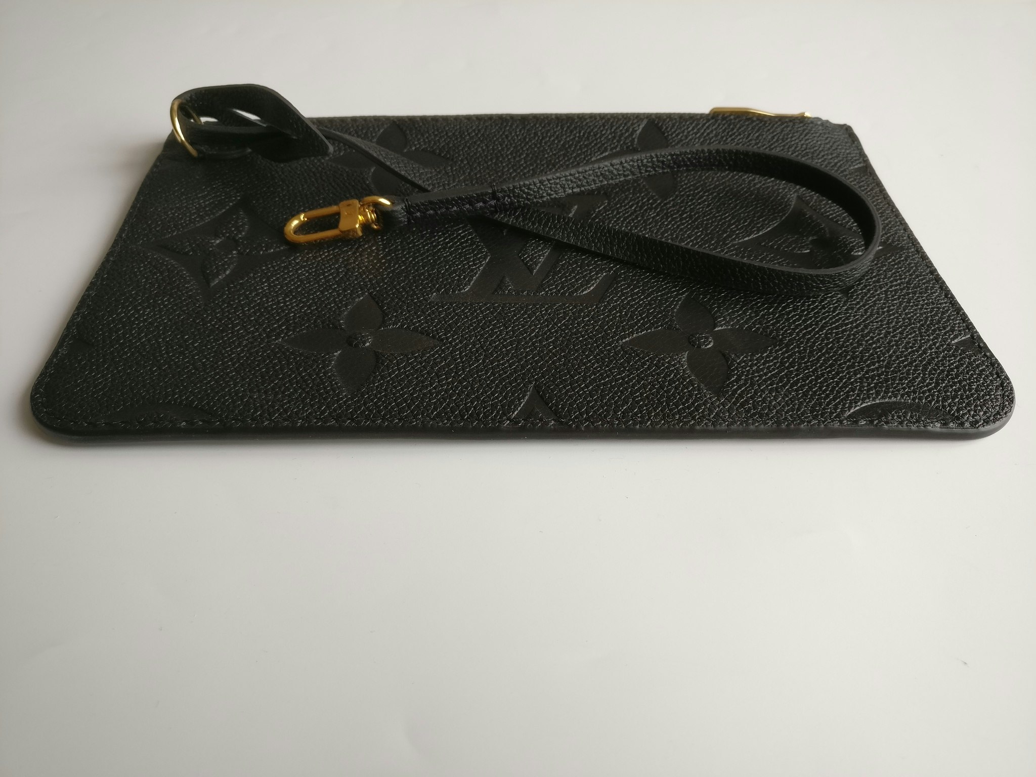 Louis Vuitton Neverfull empreinte clutch