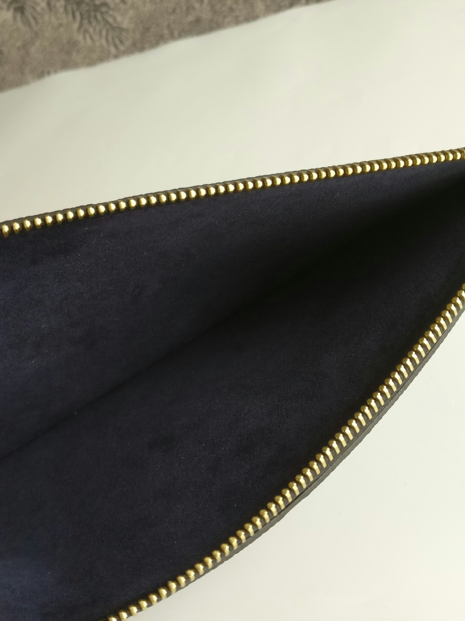Louis Vuitton Neverfull empreinte clutch
