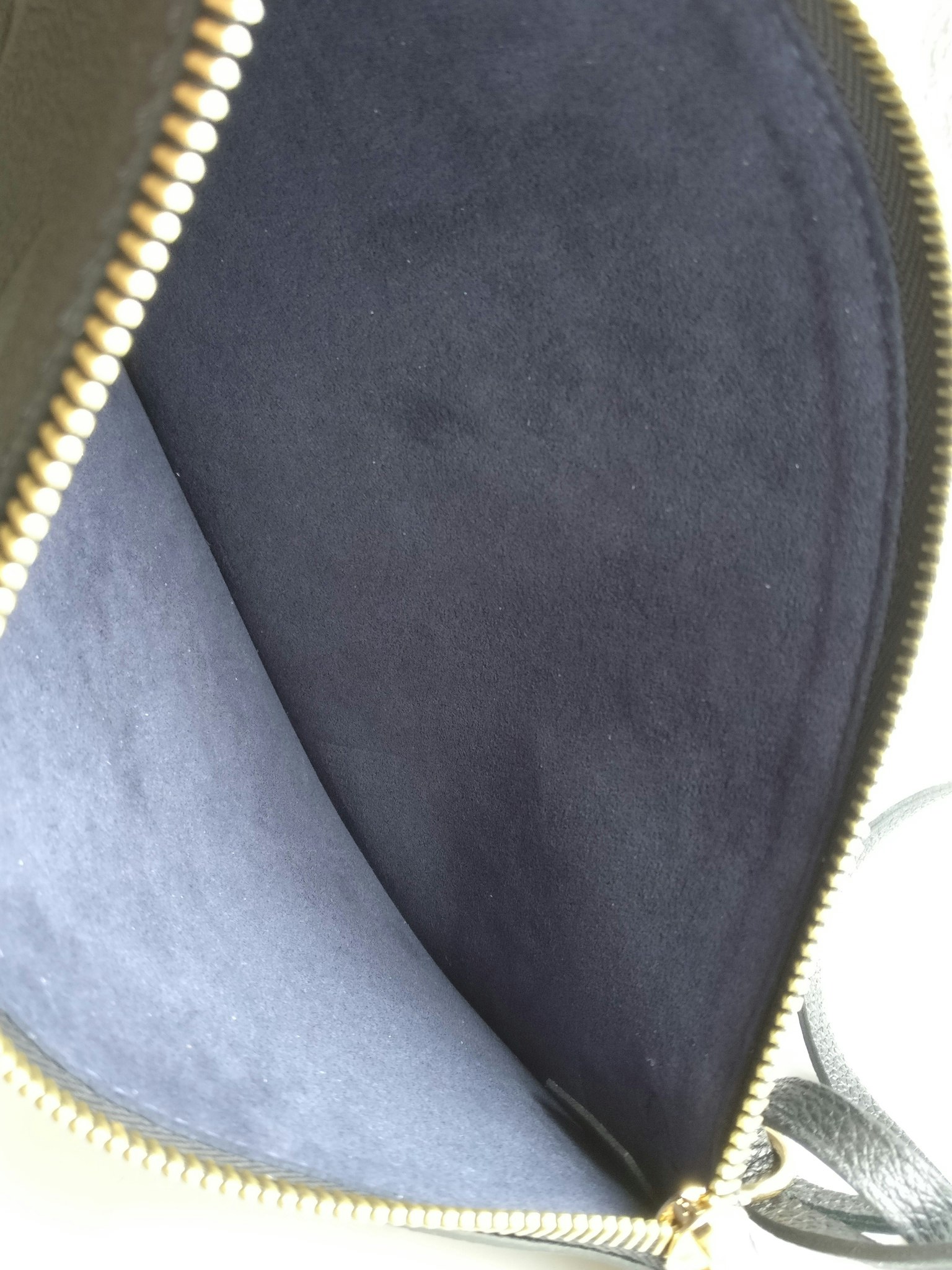 Louis Vuitton Neverfull empreinte clutch