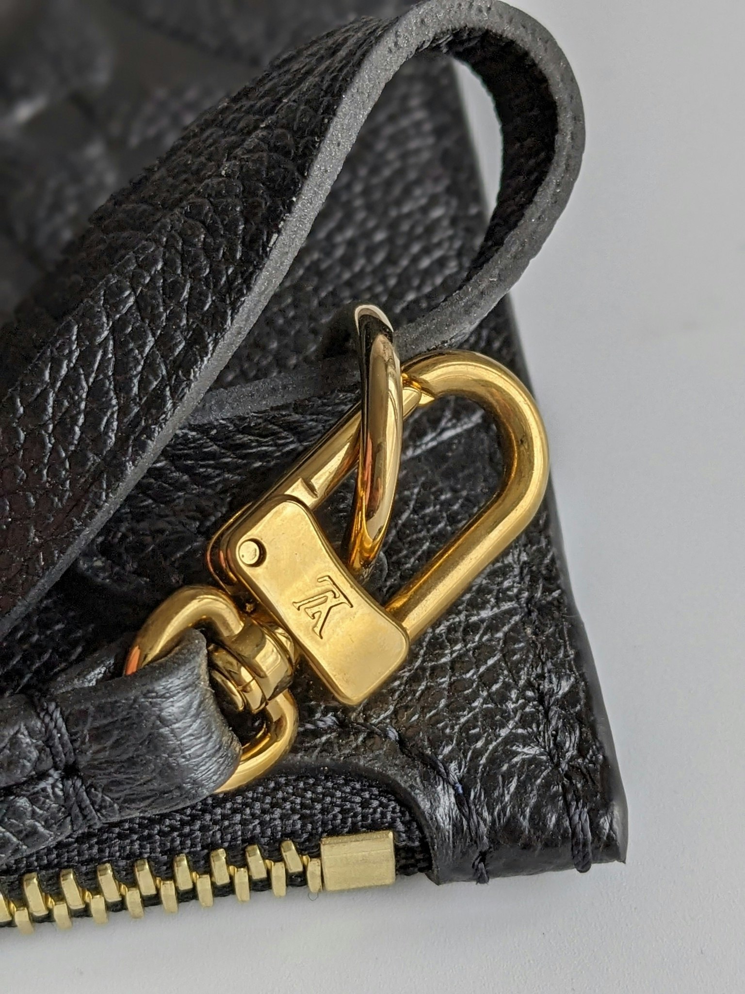 Louis Vuitton Neverfull empreinte clutch