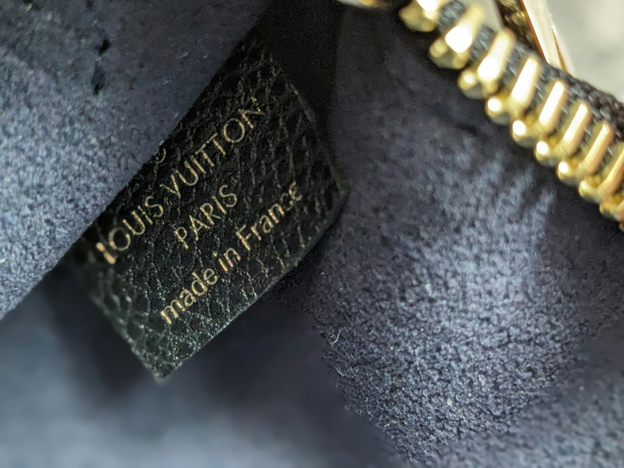 Louis Vuitton Neverfull empreinte clutch