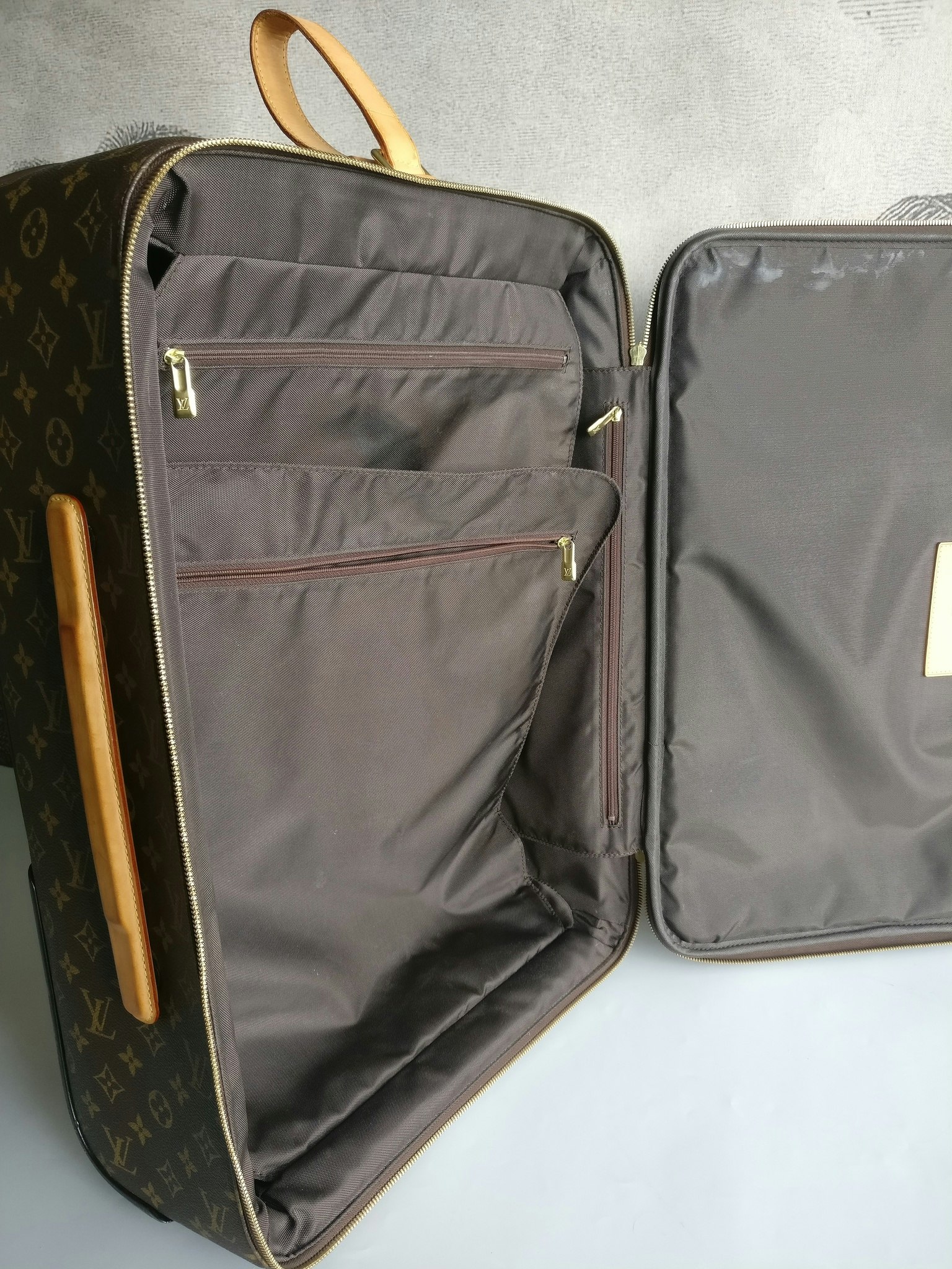Louis Vuitton Pegase 55 with bag cover
