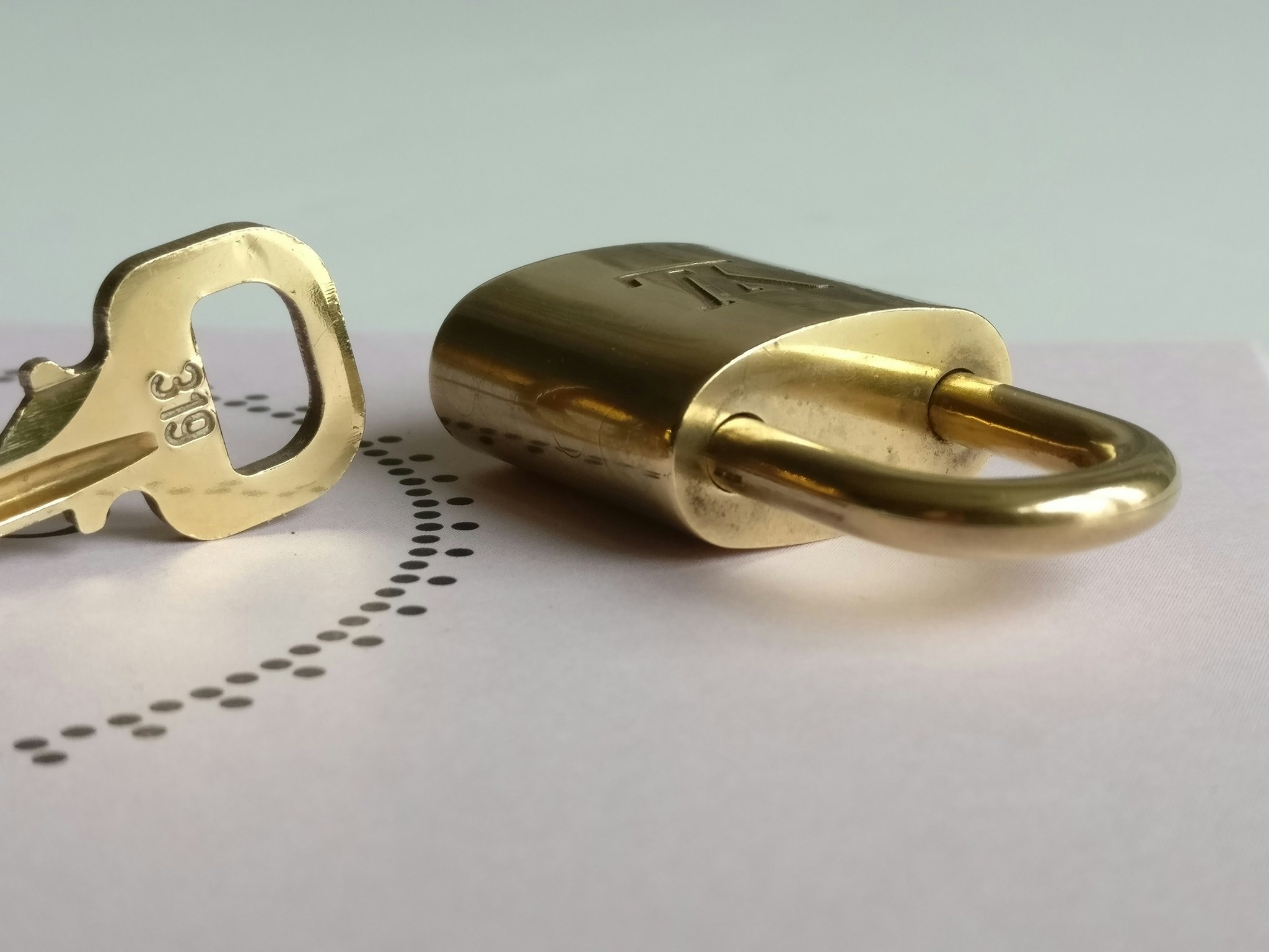 Louis Vuitton padlock with key 319