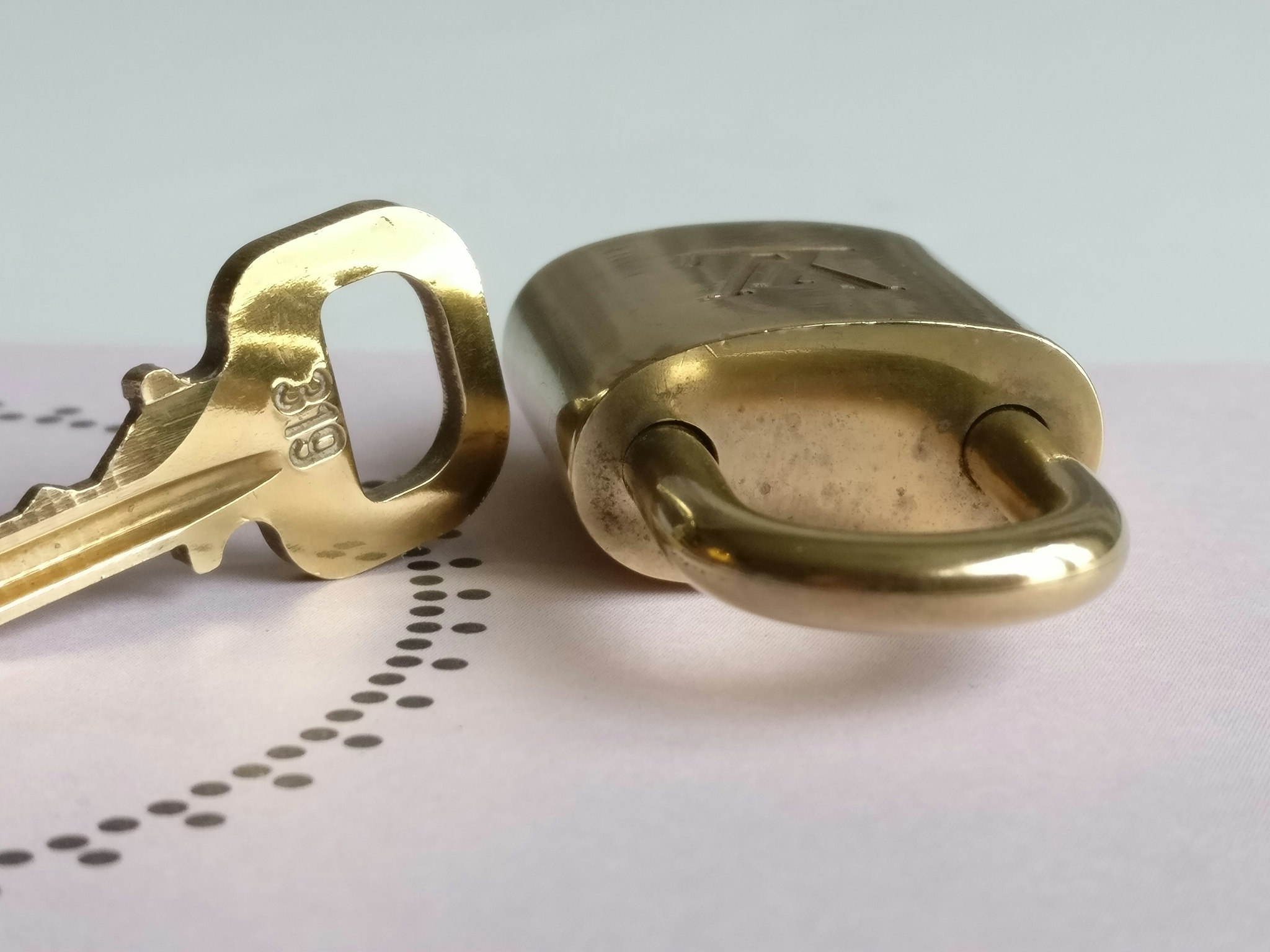 Louis Vuitton padlock with key 319