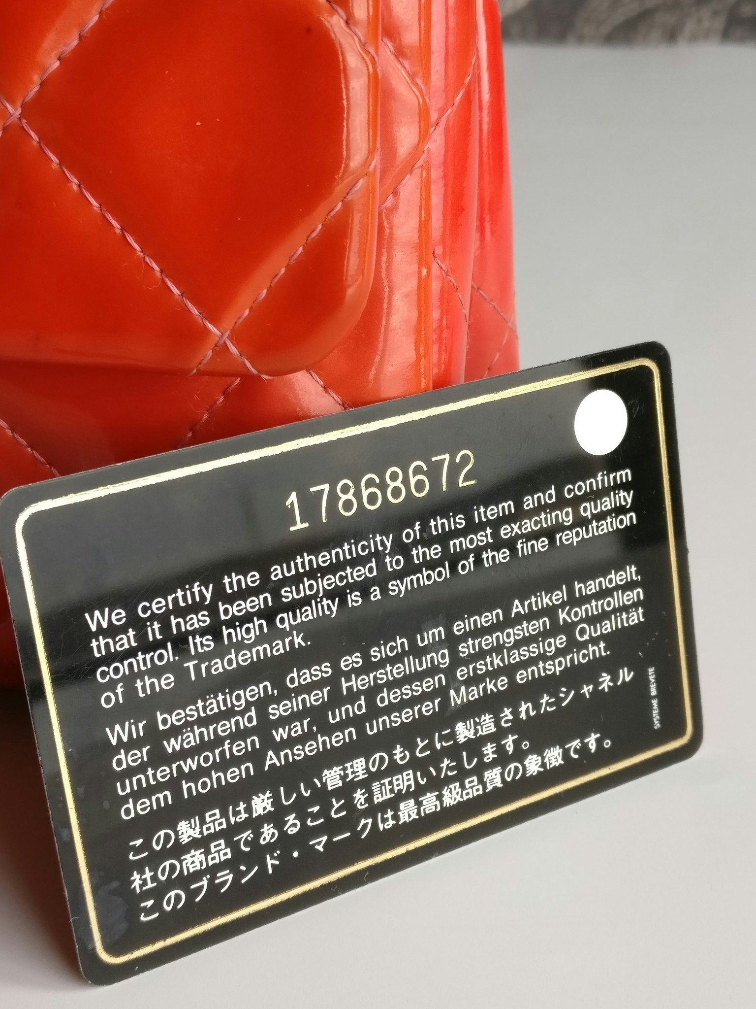 Chanel quilted red patent flap bag