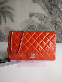 Chanel quilted red patent flap bag