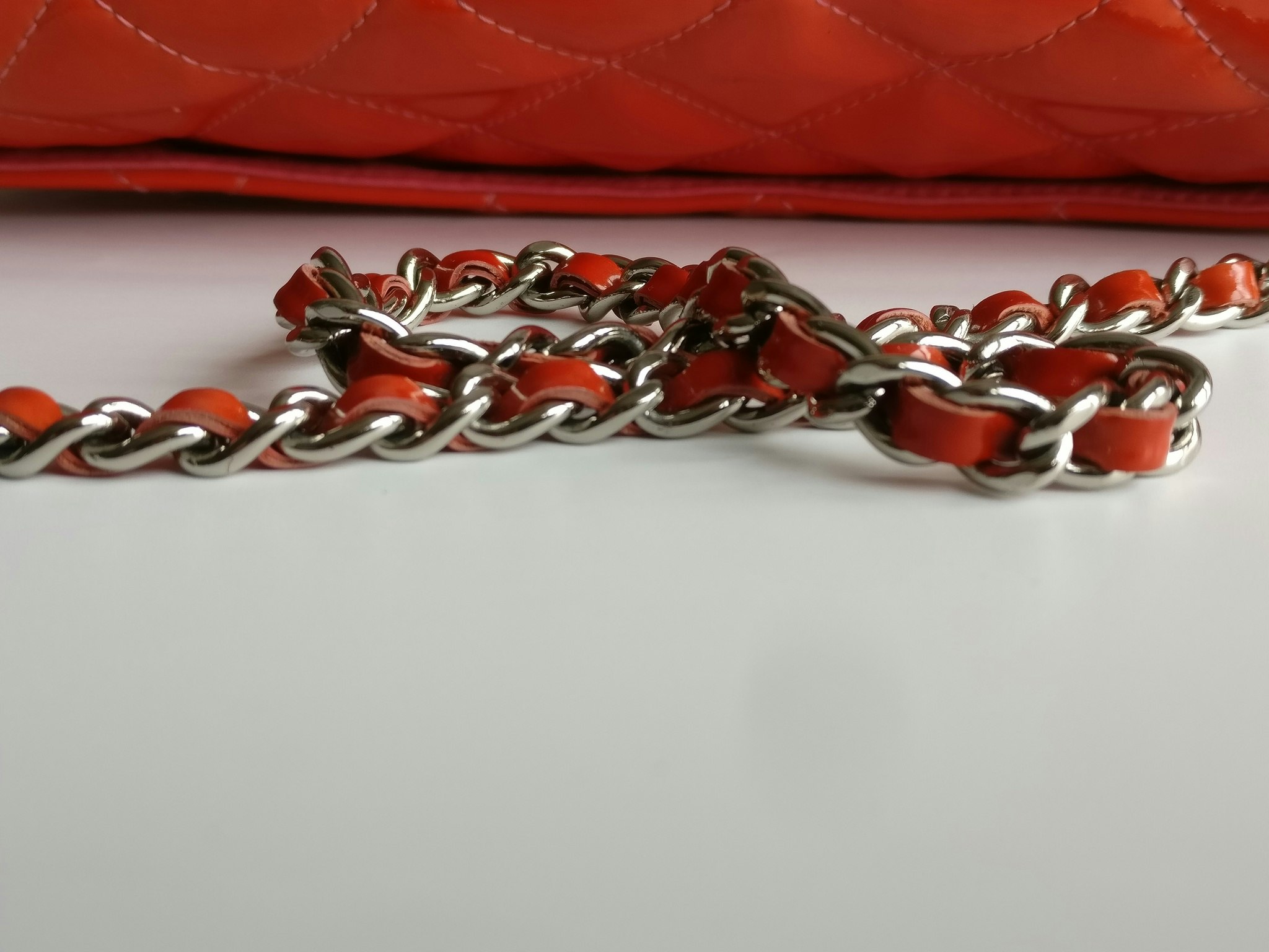 Chanel quilted red patent flap bag