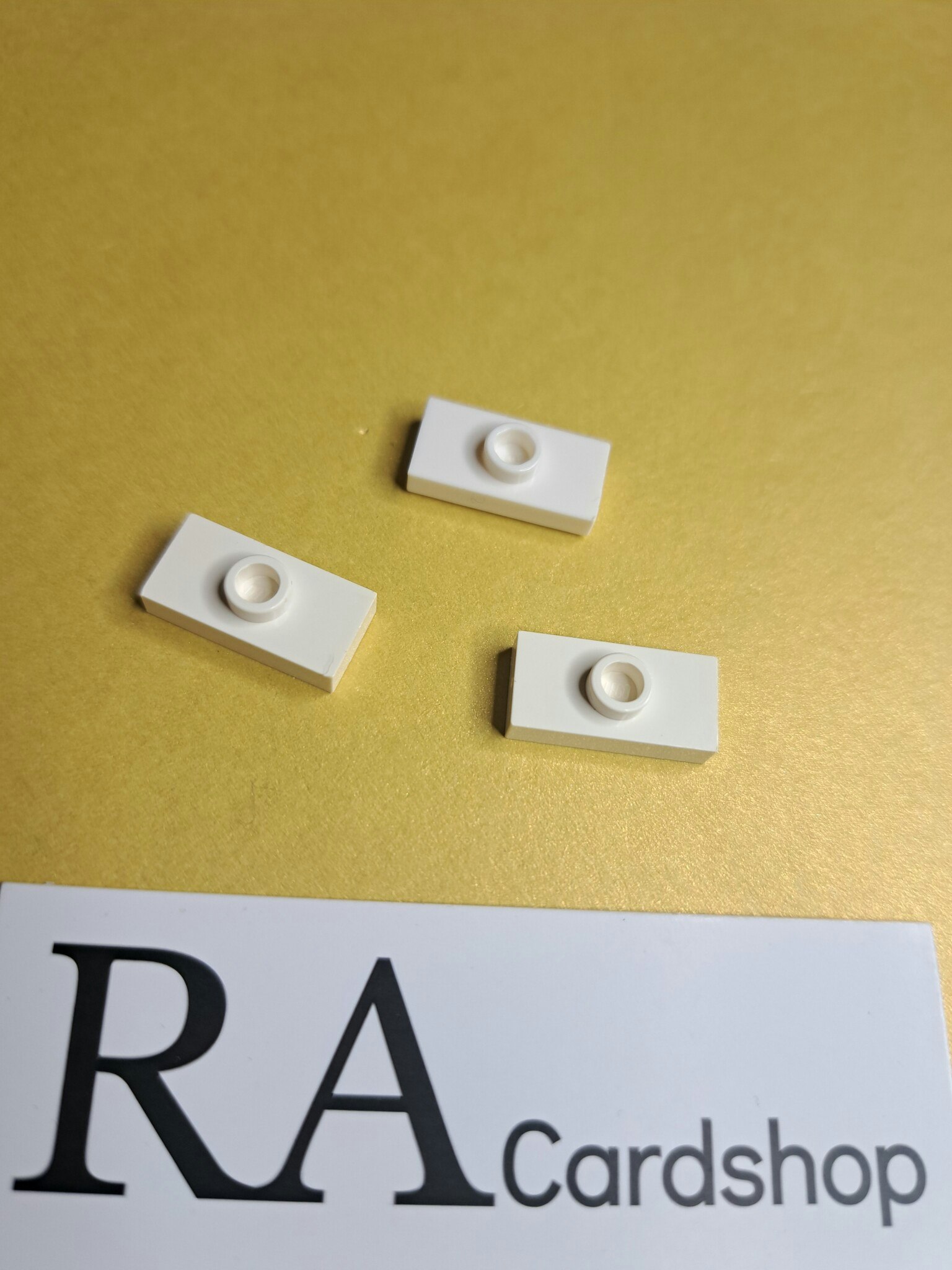 15573 Plate, Modified 1 x 2 with 1 Stud with Groove and Bottom Stud Holder (Jumper) White Lego