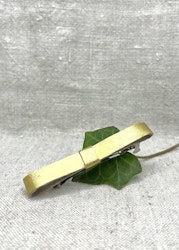 Hårklämma, stor med guldig läderrosett