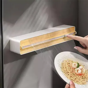 Plastic foil dispenser with sliding cutter