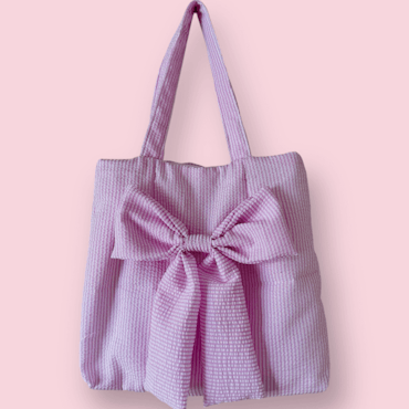 Handsydd tygpåse med rosett - rosa med ränder