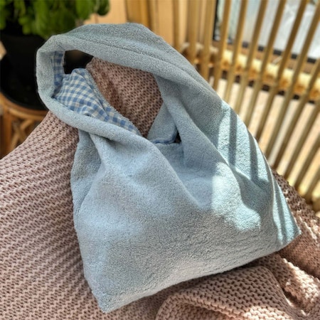 Vändbar handsydd Frottépåse för bad