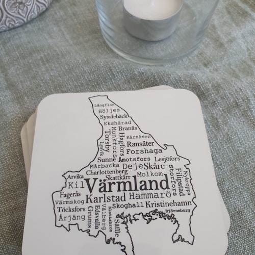 Glasunderlägg med endel orter i Värmland.