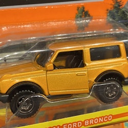Skala 1/64 Matchbox "Moving parts" - Ford Bronco 2021' Lätt böjt kort/förpackning