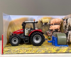 Skala 1/32 Britains Traktor Massey Ferguson 561Z med baklyft och två rundbalar och kreatur