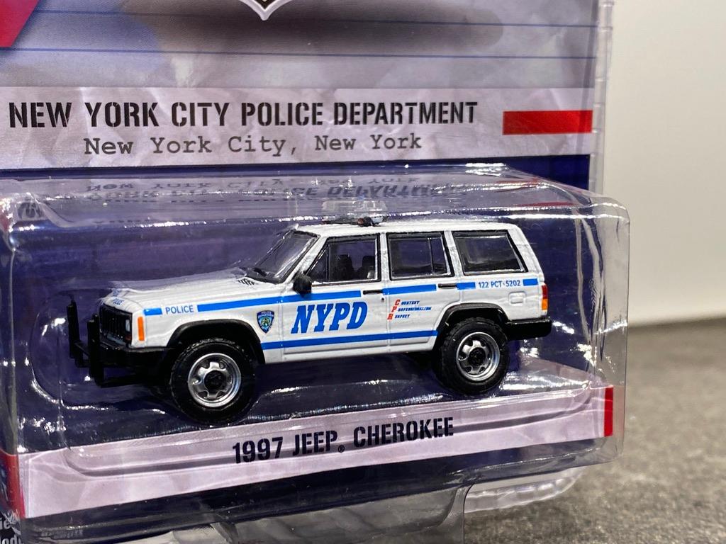 Skala 1/64 JEEP Cherokee 97 NYPD' "Hot Pursuit" från Greenlight