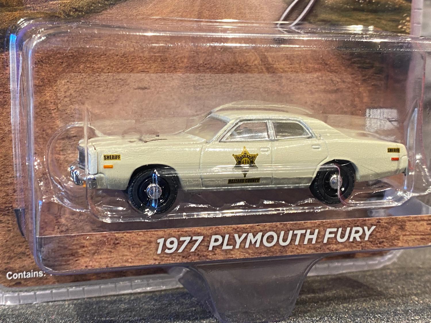 Skala 1/64 Plymouth Fury 77' Riverton Sheriff Hazzard County från Greenlight Excl.
