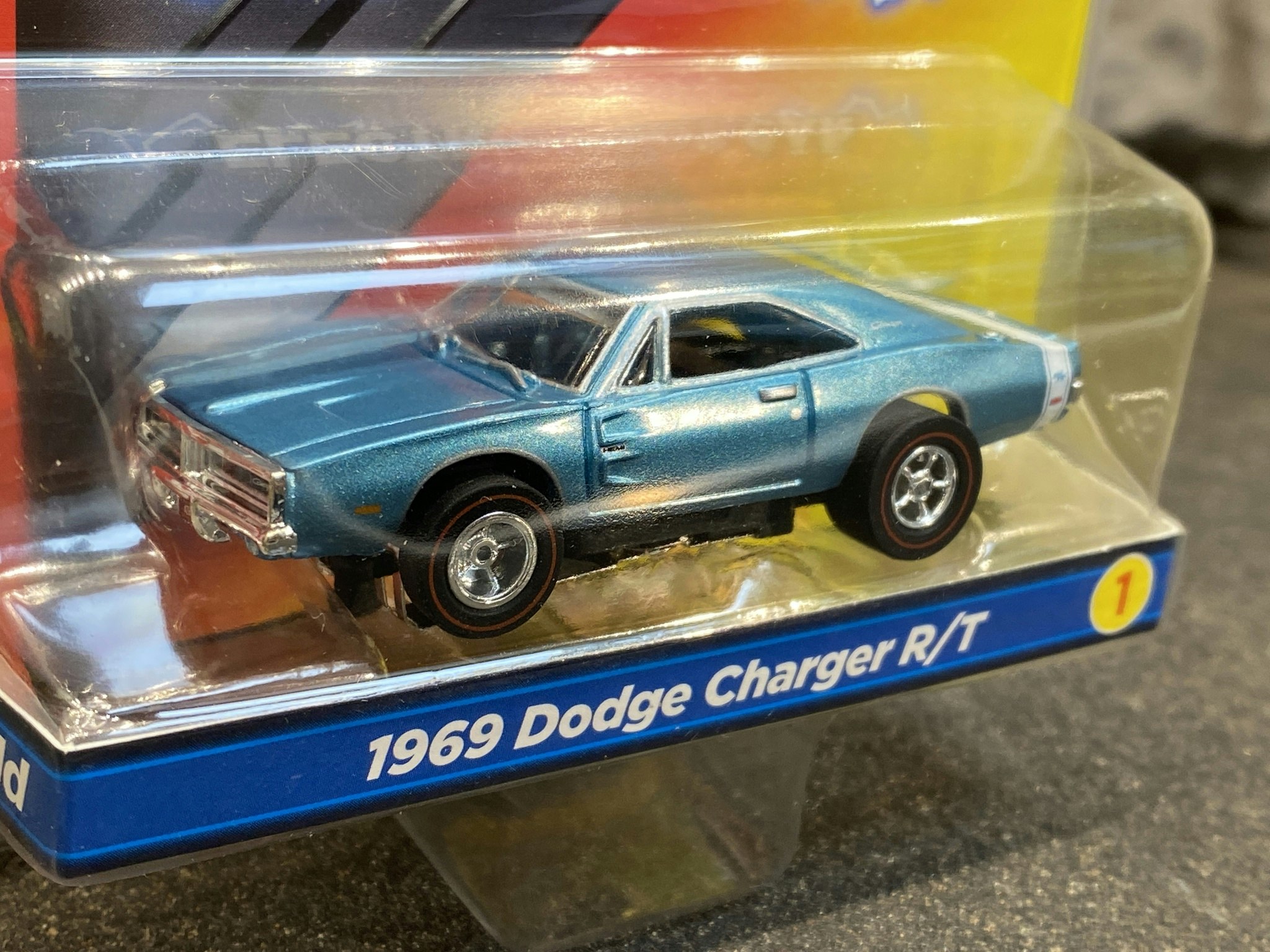 Skala 1/64 Bil för Bilbana, Dodge Charger R/T 69'', "Xtraction Ultra-G" från Auto World