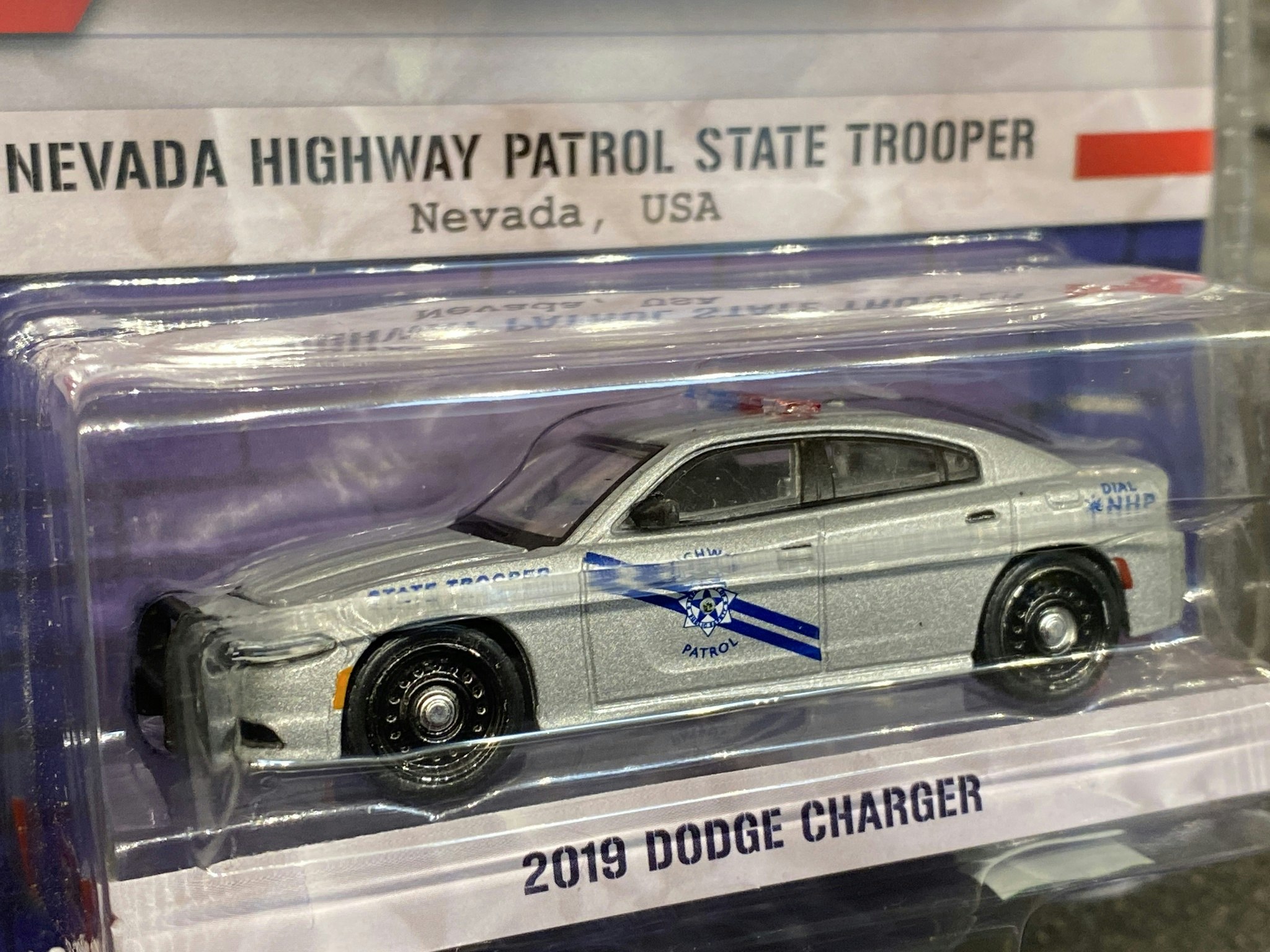 Skala 1/64 Dodge Charger 2019 Nevada State Trooper "Hot Pursuit" från Greenlight
