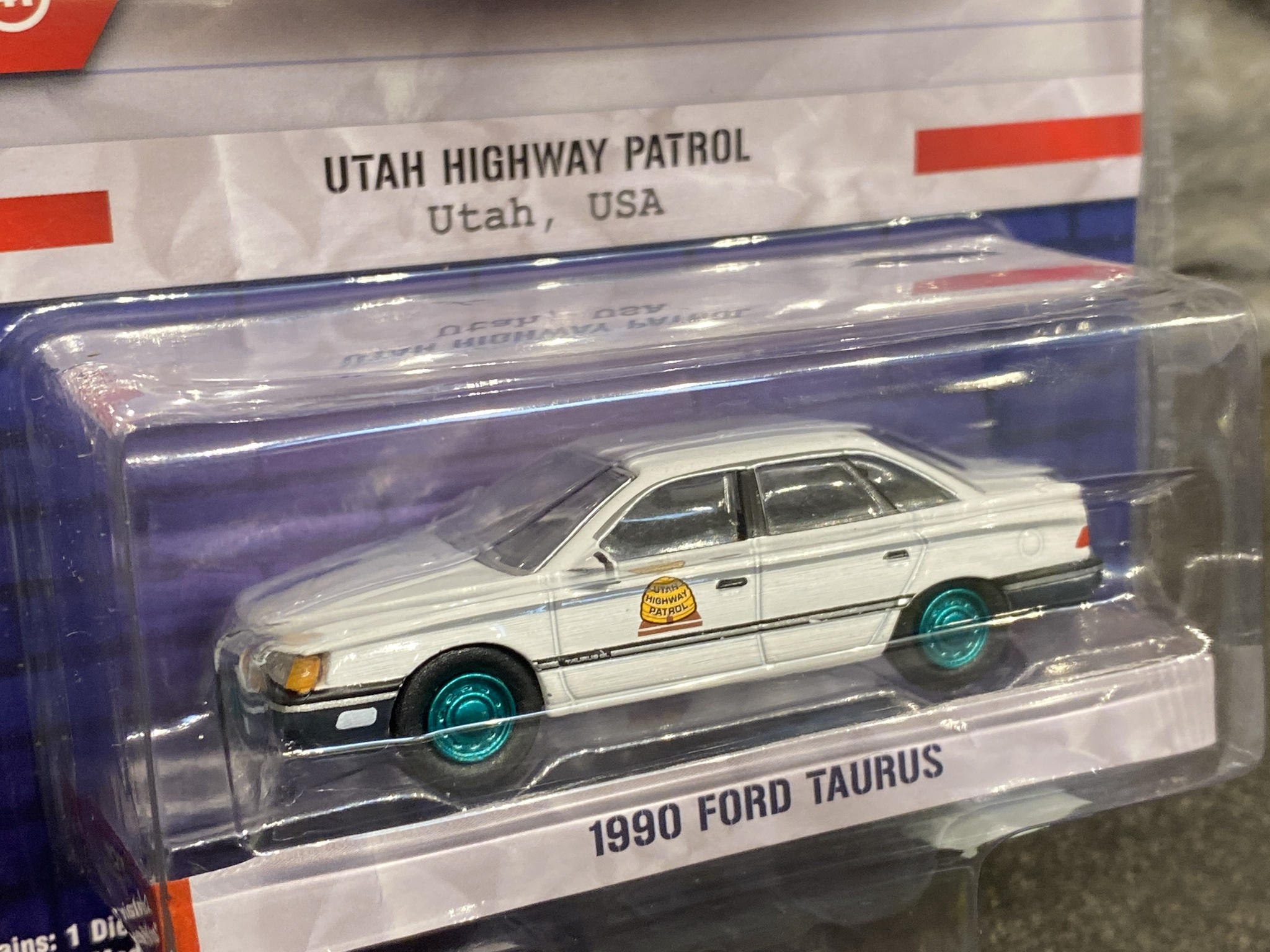 Skala 1/64 Ford Taurus 90' Utah Highway Patrol "Hot Pursuit" från Greenlight "Green Ed"