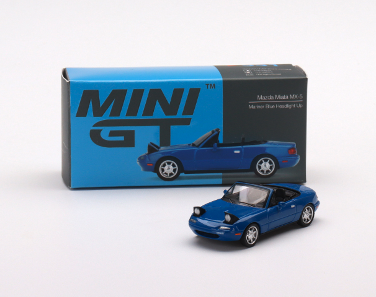 Skala 1/64 - Mazda Miata MX-5 (NA), Blå med lamporna uppfällda Vä styrd, fr MINI GT