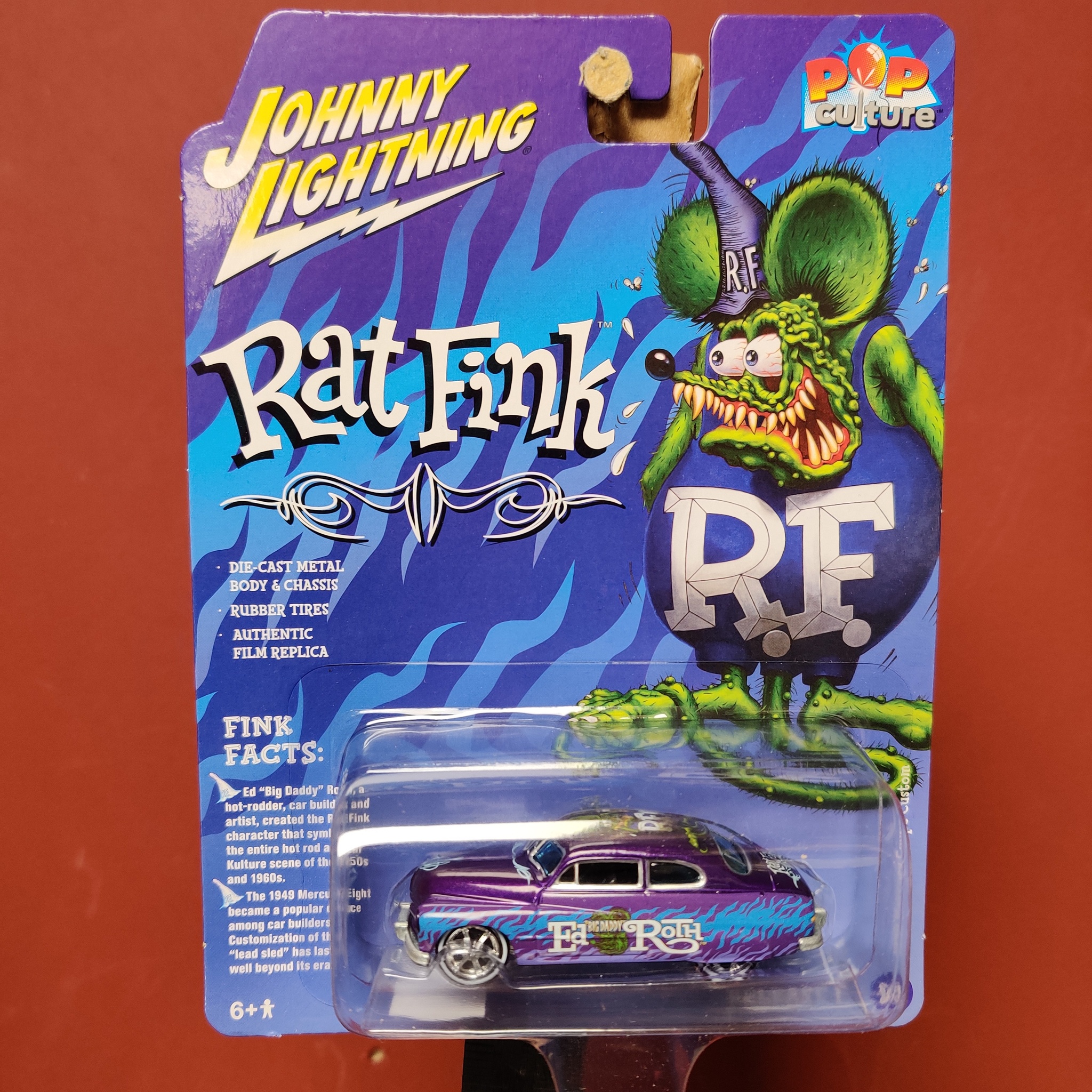Skala 1/64 Mercury Coupe Custom 49' "Rat Fink - Pop Culture" från Johnny Lightning