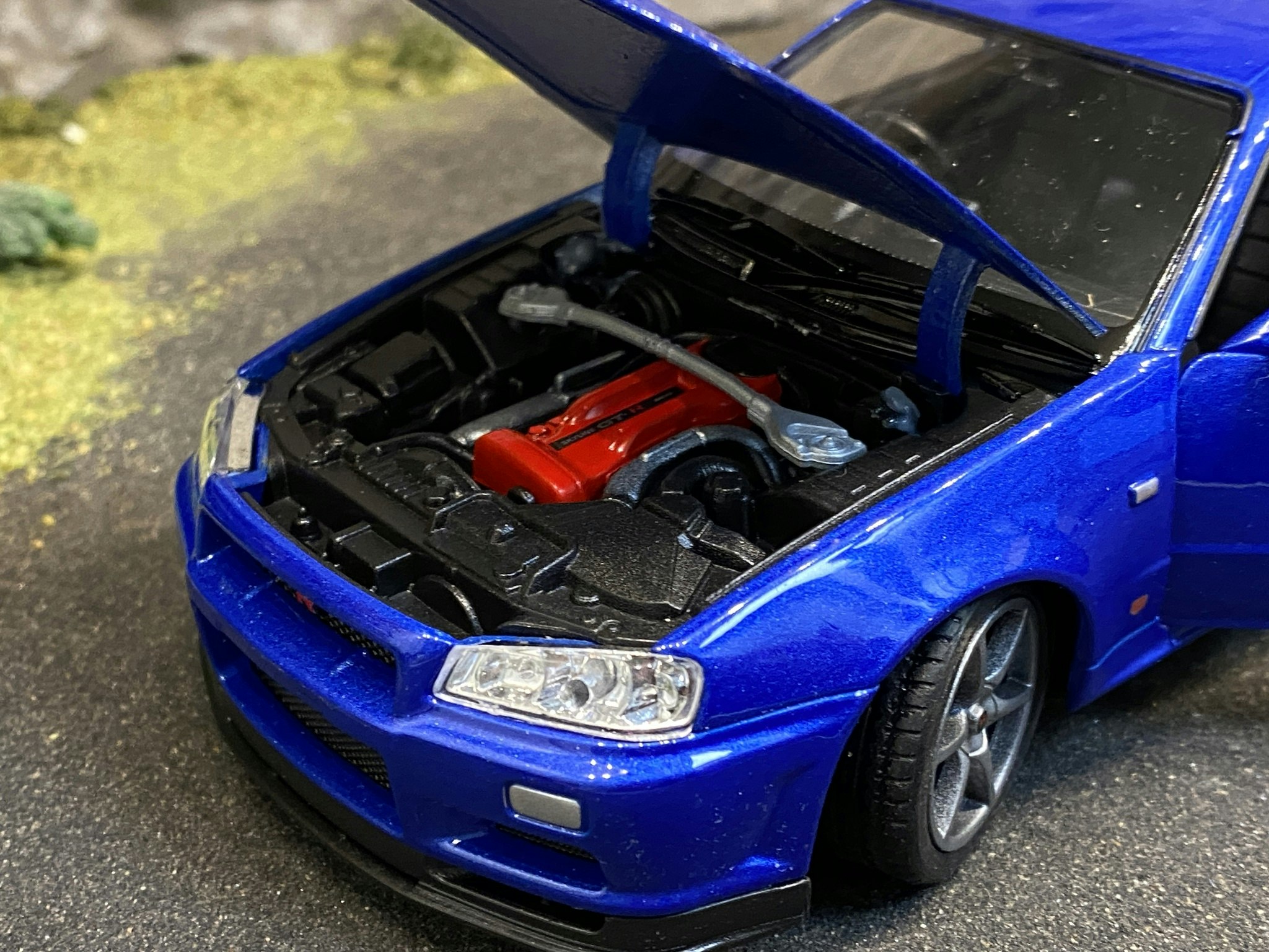 Skala 1/24 Nissan Skyline GT-R (R34), Blå från Nex models / Welly