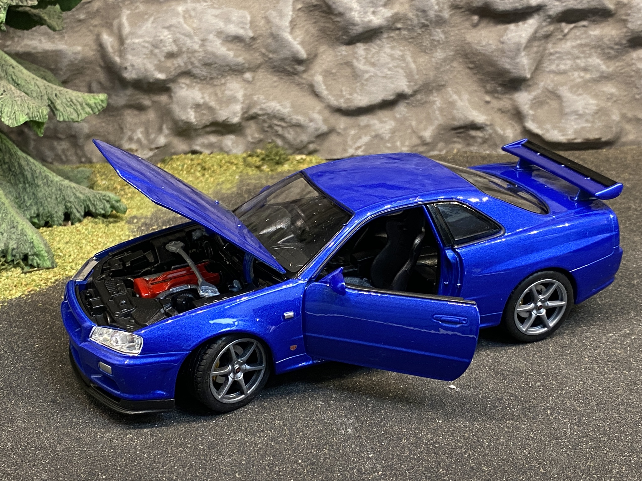 Skala 1/24 Nissan Skyline GT-R (R34), Blå från Nex models / Welly