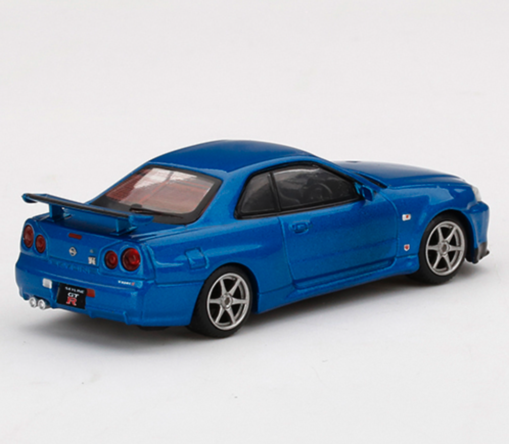 Skala 1/64  Nissan Skyline GT-R (R34) V-Spec II Bayside Blue fr Mini GT