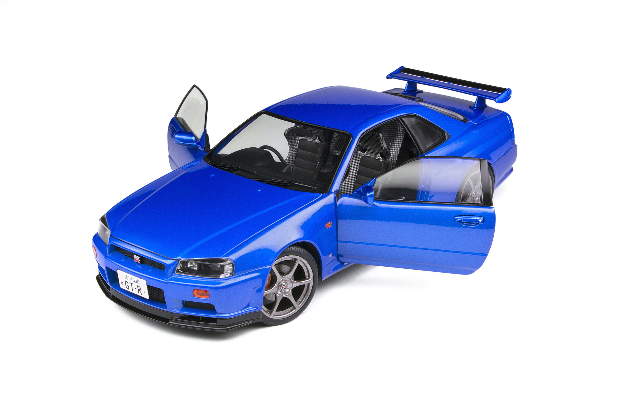 Skala 1/18 NISSAN SKYLINE GT-R (R34) – BAYSIDE BLUE – 1999 fr Solido