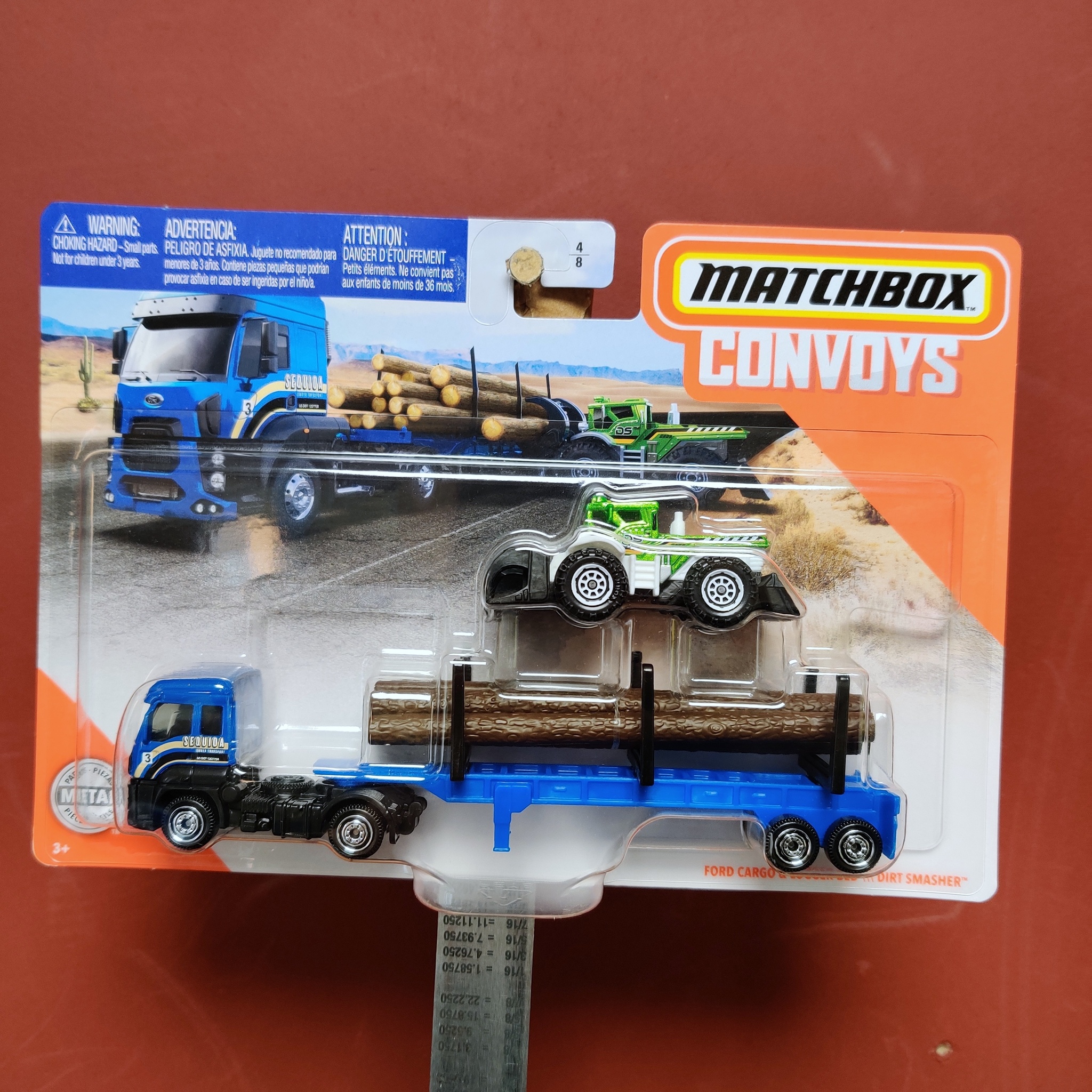 Skala 1/64 Matchbox "Convoys" - Ford Cargo & Logger Bed - Dirt Smasher