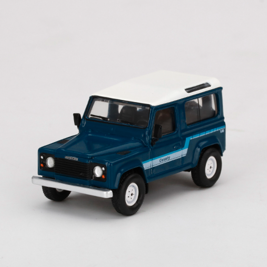 Skala 1/64 Land Rover Defender 90 County Wagon, Stratos Blue fr MINI GT