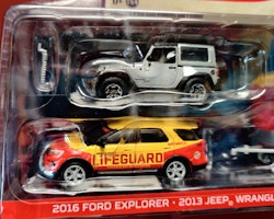 Scala 1/64 - "BayWatch" Jeep Wrangler Rubicon, Ford Explorer '16 w Enclosed CarHauler GreenLight Hollywood