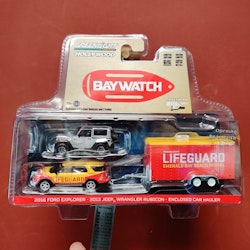 Scala 1/64 - "BayWatch" Jeep Wrangler Rubicon, Ford Explorer '16 w Enclosed CarHauler GreenLight Hollywood