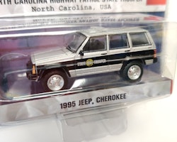 Skala 1/64 Jeep Cherokee 95' North Carolina "Hot Pursuit" från Greenlight