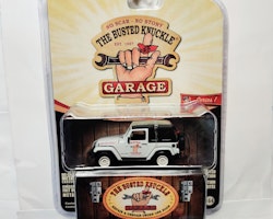Skala 1/64 Greenlight "The Busted Knuckle Garage" Jeep Wrangler 2012 Ser.1
