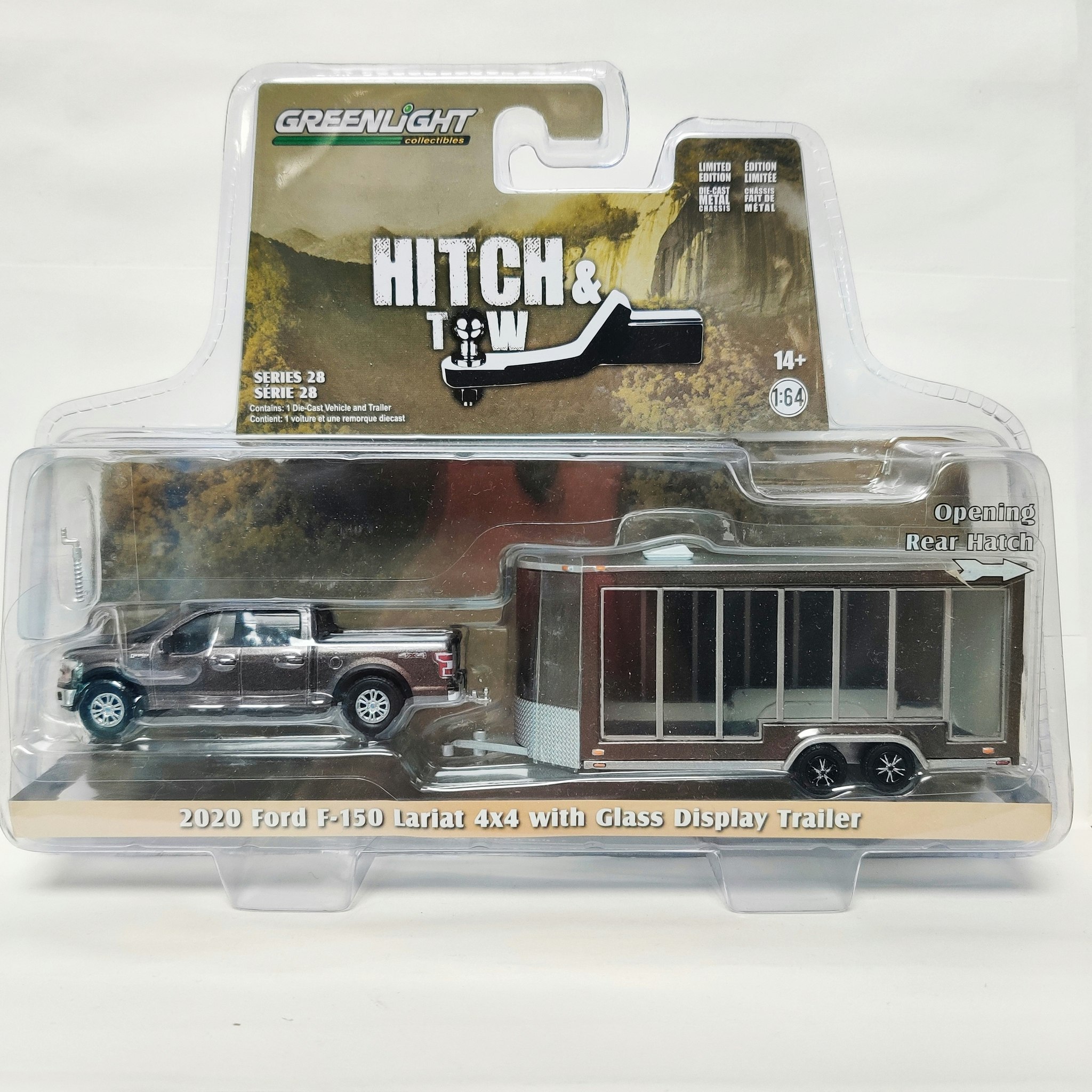 Skala 1/64 GreenLight Hollywood "Hitch & Tow" Ford F-150 Lariat 4x4 m/w Glass Display Trailer