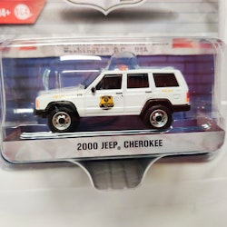 Skala 1/64 Greenlight Excl."Hot Pursuit" Secret Service: Jeep Cherokee 2000