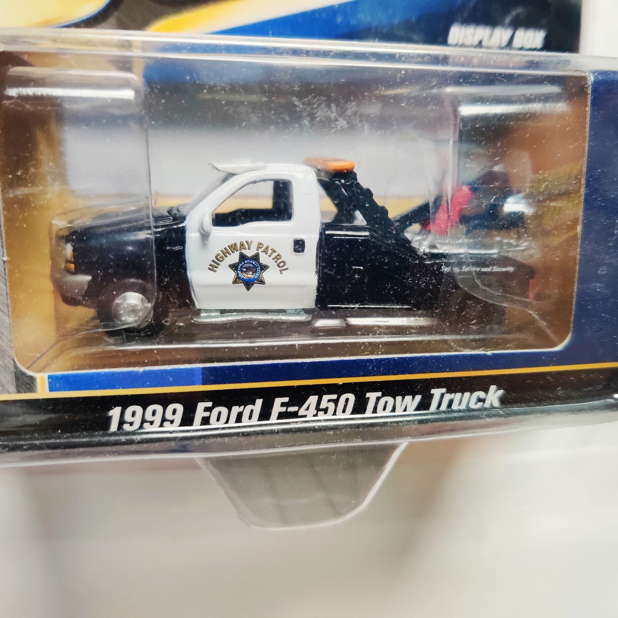 Skala 1/64 Greenlight "Active Duty" Ford F-450 Tow Truck 1999