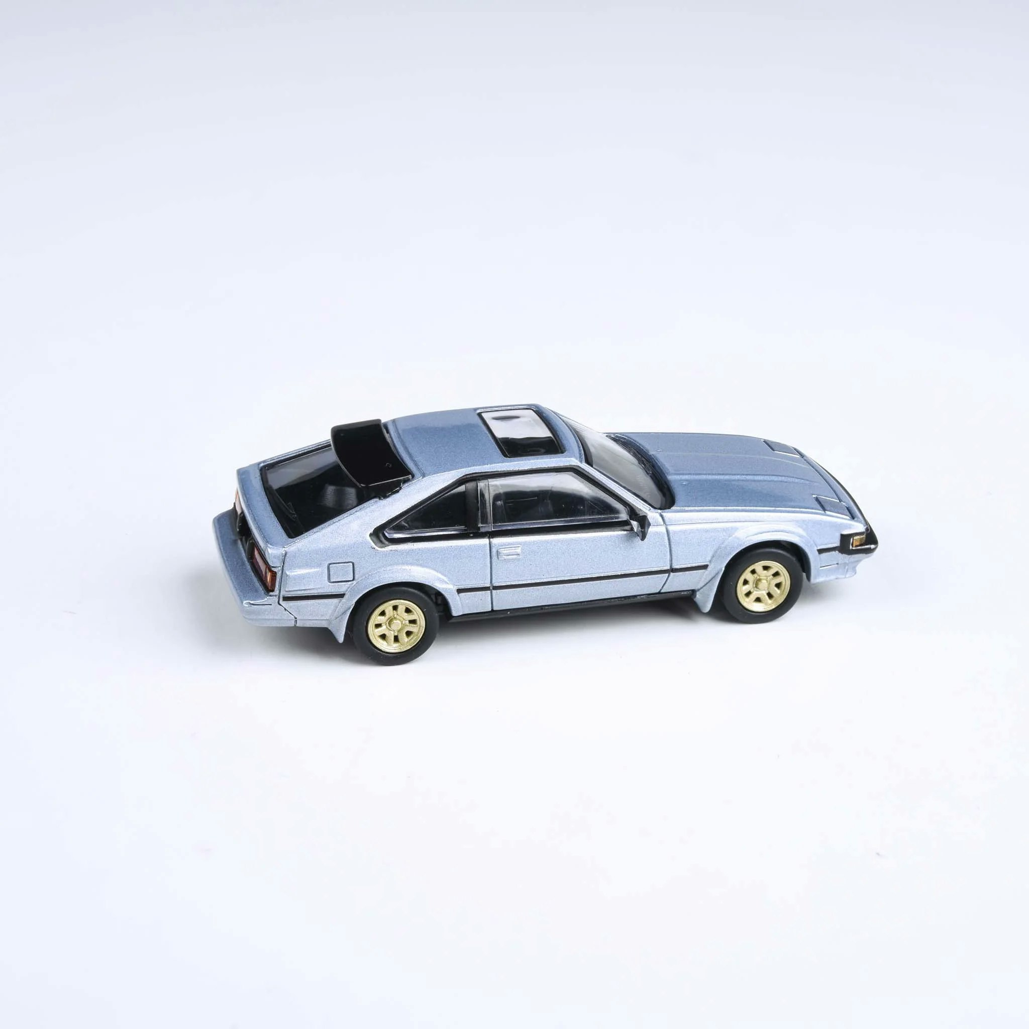 Skala 1/64 1984 Toyota Celica Supra XX L Blue met, Lights down fr Para64