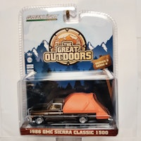 Skala 1/64 Greenlight "The Great Outdoors" 1986 GMC Sierra Classic 1500