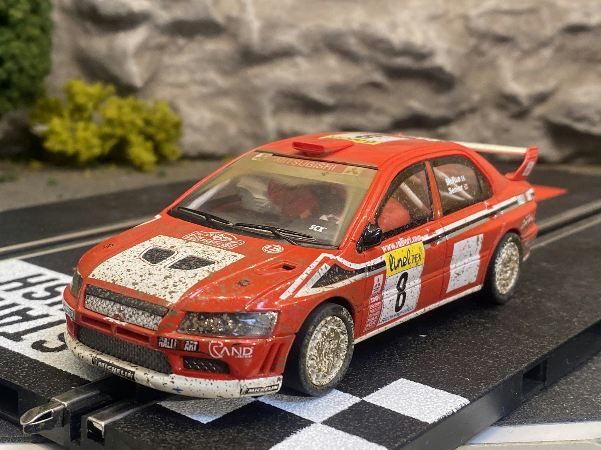 Skala 1/32 Used Analoge slotcar: Mitsubishi Lancer Evo 7 (Muddy) fr SCX