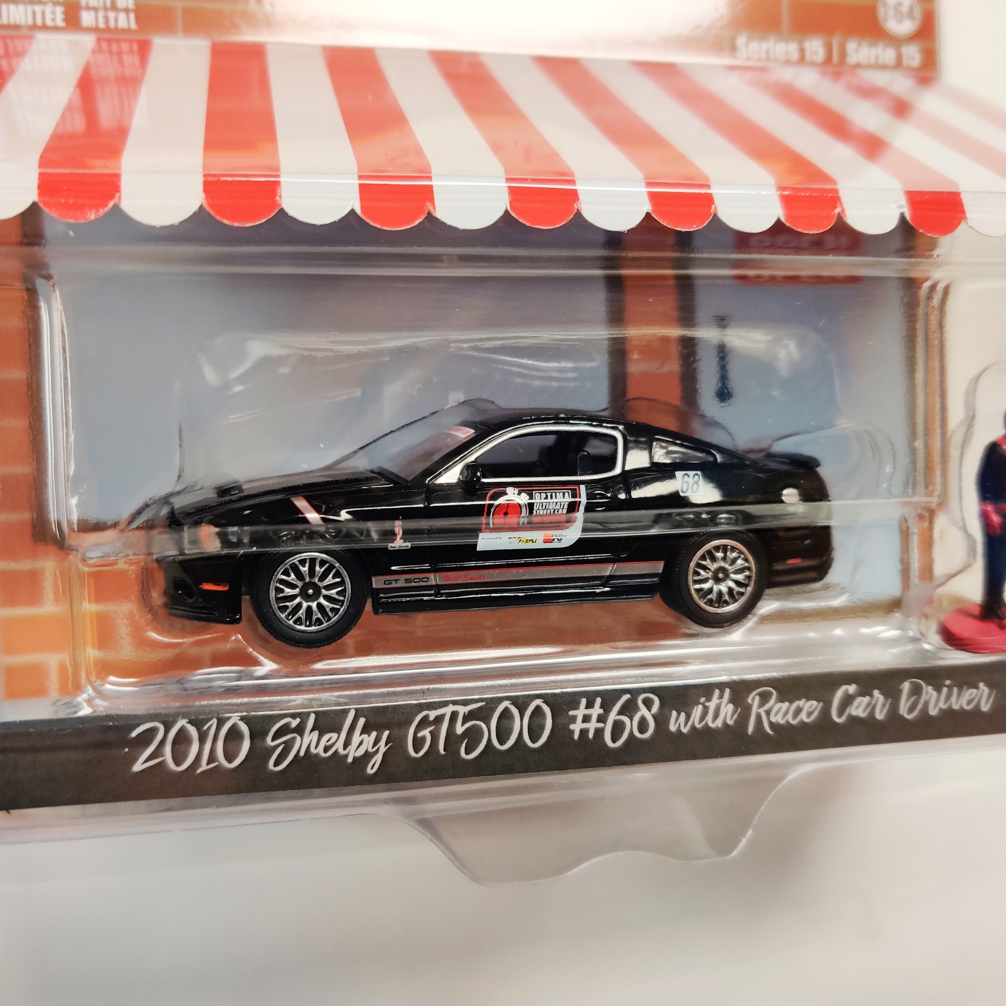 Skala 1/64 Greenlight "The Hobby Shop" 2010 Shelby GT500 #68 w Racer car driver