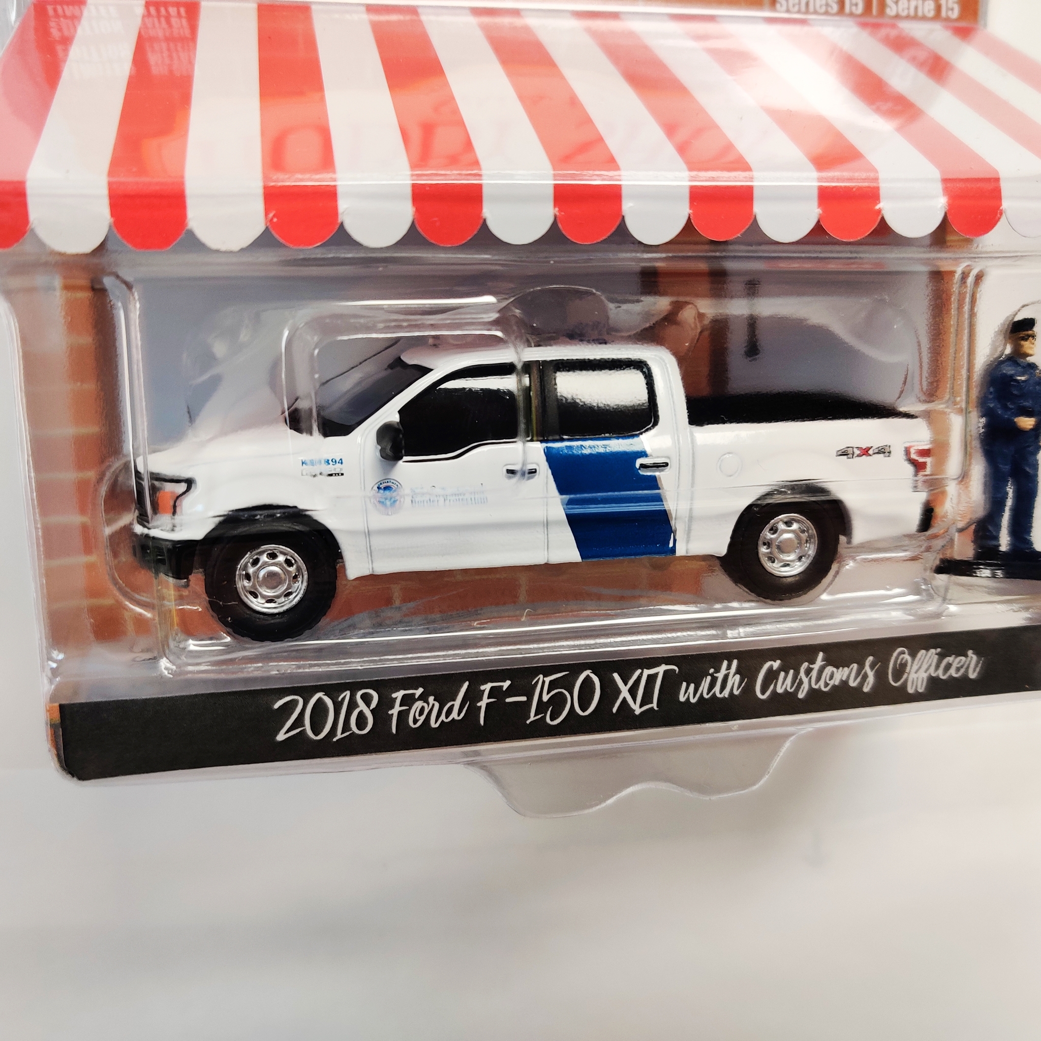 Skala 1/64 Greenlight "The Hobby Shop" 2018 Ford F-150 XLT w Officer