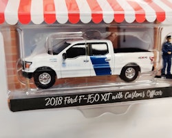 Skala 1/64 Greenlight "The Hobby Shop" 2018 Ford F-150 XLT w Officer